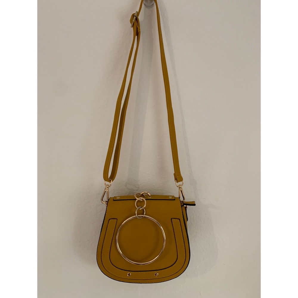 Yellow crossbody purse.